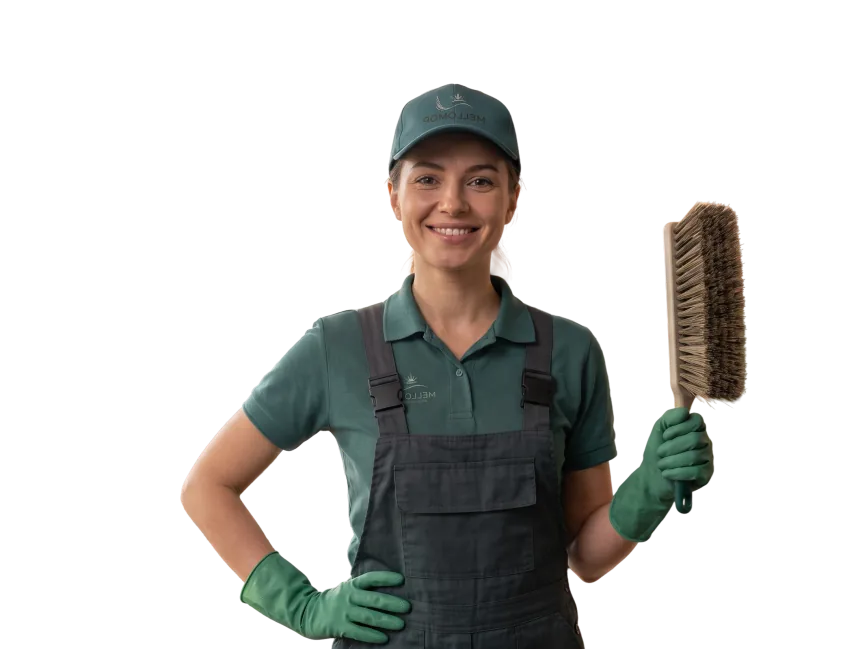 MelloMop cleaner holding a brush, hand on her hip